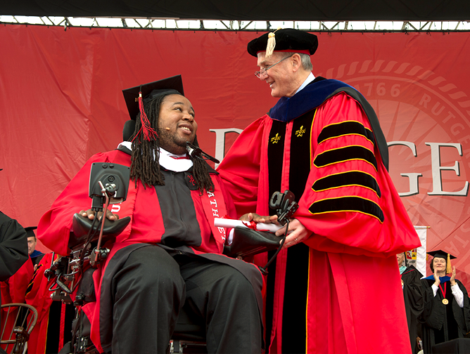 President Barchi presents Eric LeGrand with his Rutgers diploma 